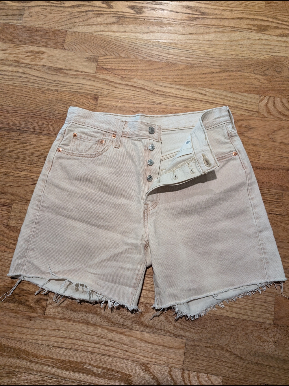 Levi's Light Cream High-Rise Frayed Hem Denim Shorts